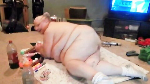 Obese BBW granny lies nude on floor spreading massive pale ass and hairy pussy