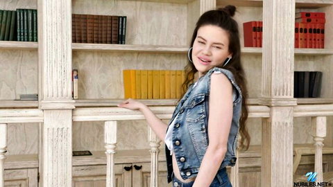 Tina Grey teases her natural boobs in socks, smiling in denim vest