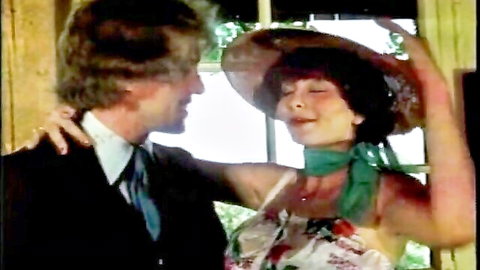 Desiree Cousteau in retro intimate embrace and kiss in Laces & Spice Swedish Erotica