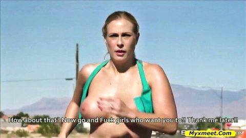 Blonde busty woman flashing massive tits outdoors in green top