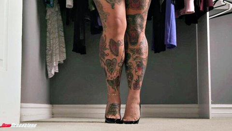 Connie Perignon in black high heels, tattooed legs teasing in closet