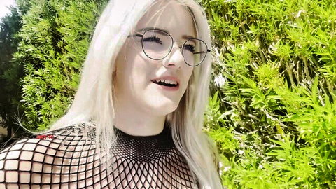 AnnaTravels blonde with glasses smiling in sexy mesh top outdoors