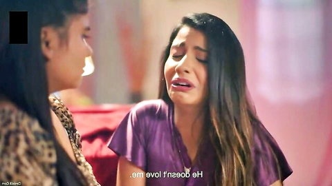 Two emotional Indian MILFs in intimate lesbian moment, one crying in purple top
