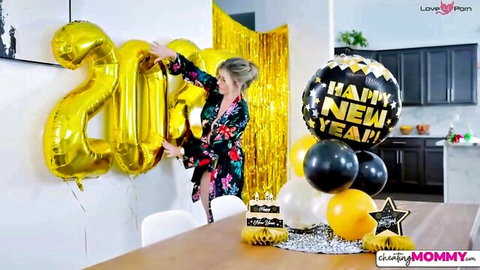 Blonde stepmom with massive tits in floral robe hanging New Year balloons