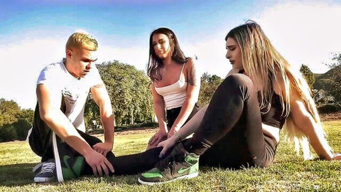 Hot brunettes dominate blonde guy in outdoor anal threesome tease