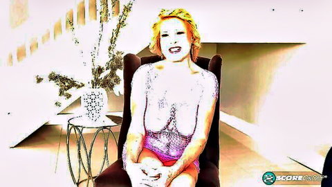 Desiree Eden in sheer sparkling lingerie, blonde MILF smiling seductively