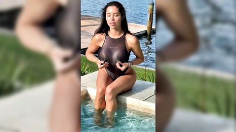 Marisol Yotta in revealing brown swimsuit by pool, big tits tease