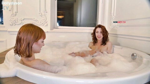Dolly Dyson and redhead in bubbly bath, small tits nude POV