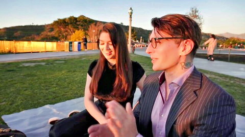 Alyx Star and Celastic Iron share intimate picnic moment outdoors at sunset
