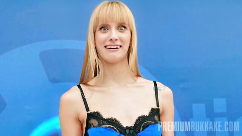 Blonde babe in sexy black lace bra smiling eagerly on blue background