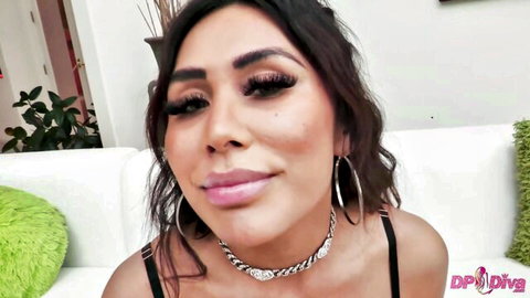 Seductive brunette with full glossy lips and hoop earrings smirks for DP Diva