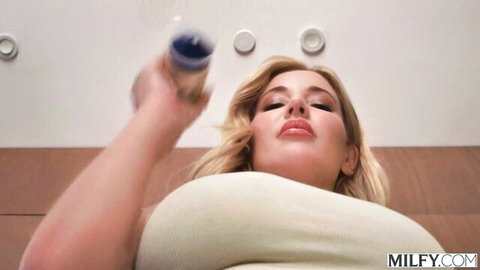 Savannah Bond blonde MILF with huge tits seductively holding drink