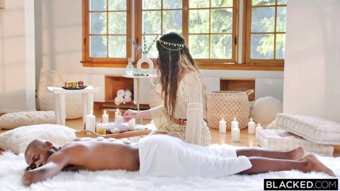 Aria Lee massages black stud in spiritual boho setting, teasing interracial encounter