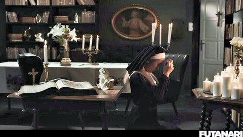 Clothed nun in black habit kneels praying with clasped hands at table with bible crosses and candles in candlelit church library