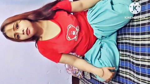 Sexy Indian babe teases with deep cleavage and thick thighs in red top and green salwar on bed