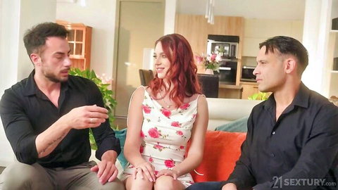 Busty redhead MILF in floral dress with two men, teasing threesome