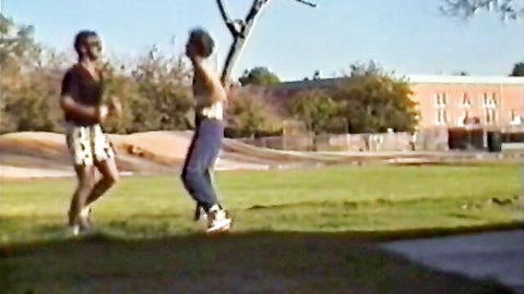 Vintage Nikki and cheerleader in pom-poms, perky tits, skirt outdoors
