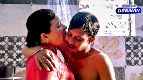 Wet Desi aunty and man kissing passionately in steamy bathroom shower