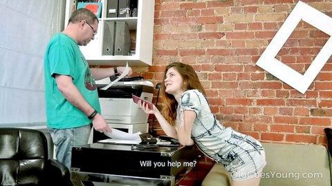 Russian redhead trainee in sheer dress seduces older boss in office