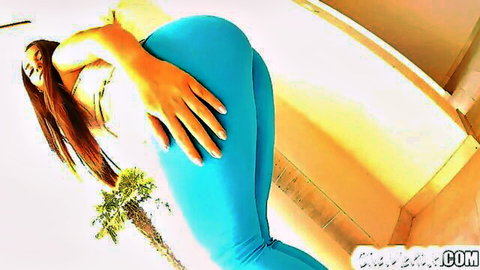 Brunette teen grabs her juicy bubble butt in tight blue leggings