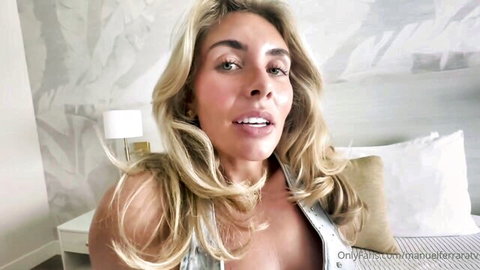Blonde MILF with massive tits teasing deep cleavage in POV bedroom selfie