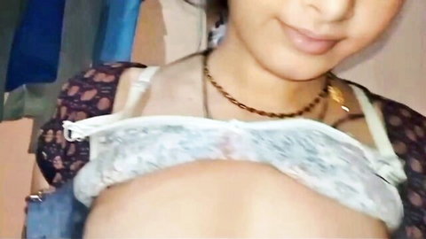 Busty Indian woman smiling in sheer lace bra pushing up massive cleavage and tits