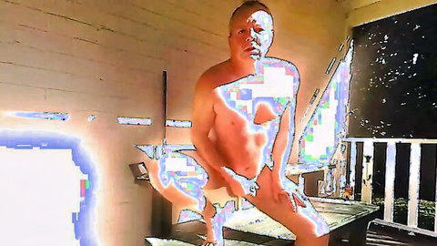 Blurry naked man squatting nude on outdoor porch exposing his bare body