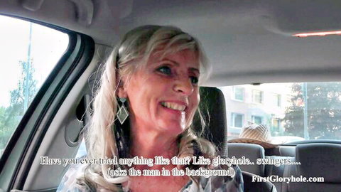 Ella, blonde MILF smiling in car before first gloryhole adventure