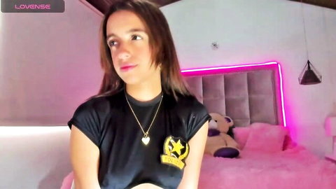 Melody Ds webcam striptease, smiling in black tank top