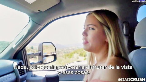 Alina Lopez smiling in truck enjoying scenic view with stepdad