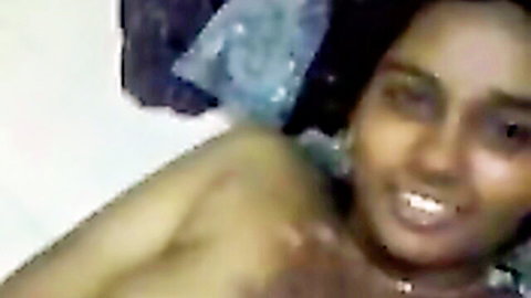 Naughty smiling South Asian brunette teasing with playful seductive expression
