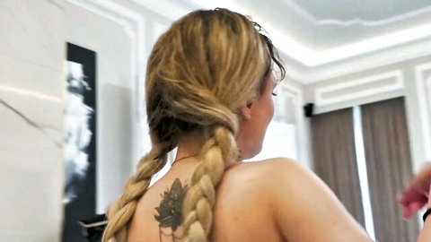 Lilith Liber blonde with braids and back tattoo in nude pose