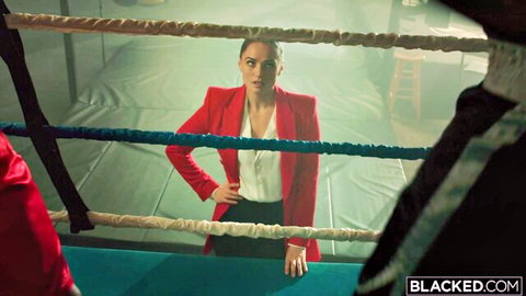 Tori Black in sexy red blazer and white blouse, confident pose in threesome preview