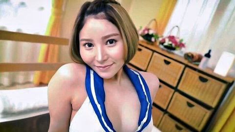Erika Shiomi smiling seductively in white halter top with cleavage