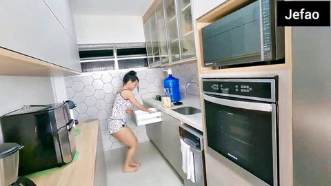 Asian wife in short dress bending over in kitchen, amateur tease
