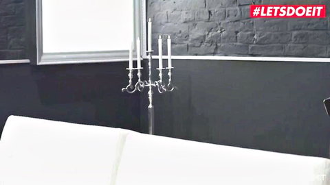 Empty luxurious bedroom set with white couch and candelabra ready for rough teen anal sex