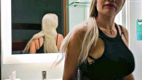 Blonde stepmom in sexy black cutout top, teasing side view