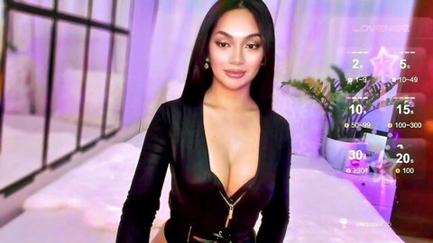 Seductive Asian camgirl in low-cut black leather top on Chaturbate stream