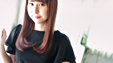 Chika Momoi smiling seductively in black top, long brown hair