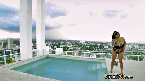 Kailani Kai BBW in sexy black bikini posing by rooftop pool