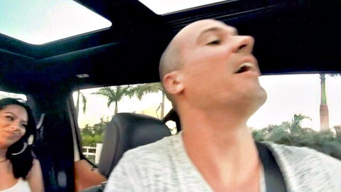 Monica Asis smiles at Sean Lawless in car, teasing anal ride preview