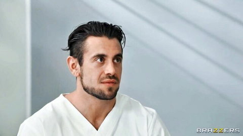 Handsome male performer in doctor scrubs for Dee Williams threesome scene