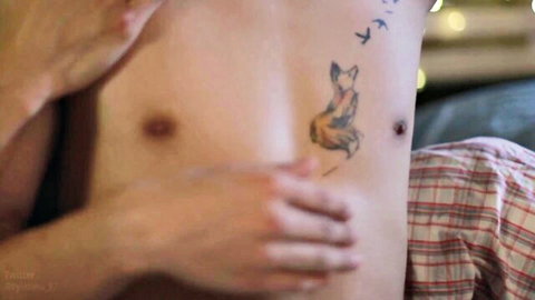 Sexy shirtless guy with fox tattoo on hip groped by hand in intimate bedroom tease