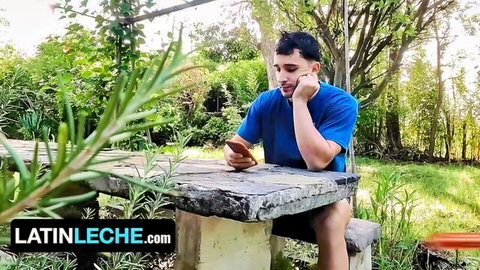 El Aleman sits outdoors in blue shirt, teasing gay rimming session