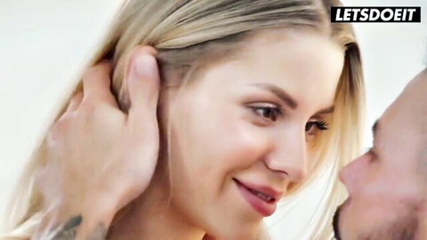 Blonde beauty in sensual neck grip with boyfriend