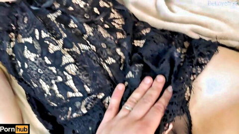 Man's hand pulls aside black lace panties exposing shaved pussy closeup POV