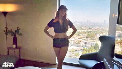 Elly Clutch redhead in crop top and shorts posing seductively