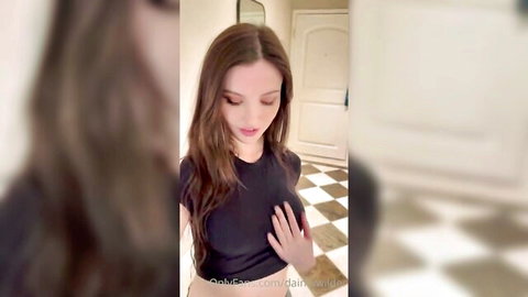Dainty Wilder in black top, slim brunette teasing with hand on chest