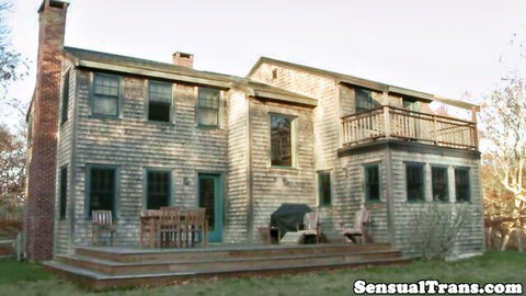 Chelsea Poe trans sensual scene at rustic shingled house exterior