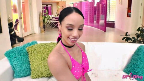 Alexis Tae smiling in pink bikini top, seductive pose